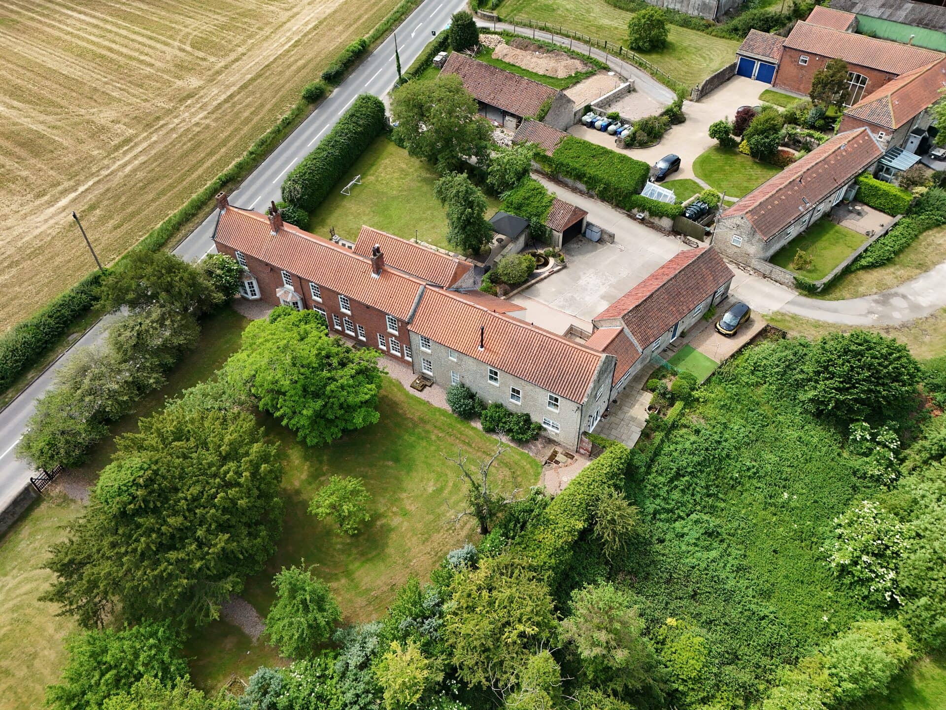 Aerial photo of homes and gardens set among mature trees in South Yorkshire